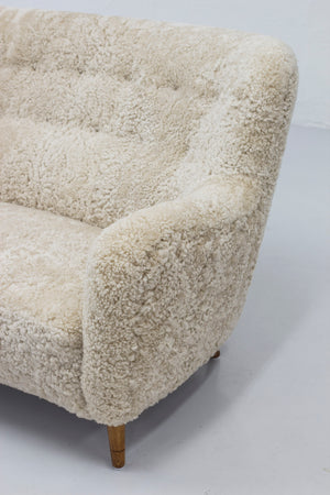 Danish modern sofa with sheep skin