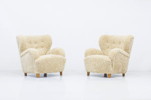 Sheep skin lounge chairs in the style of Lassen