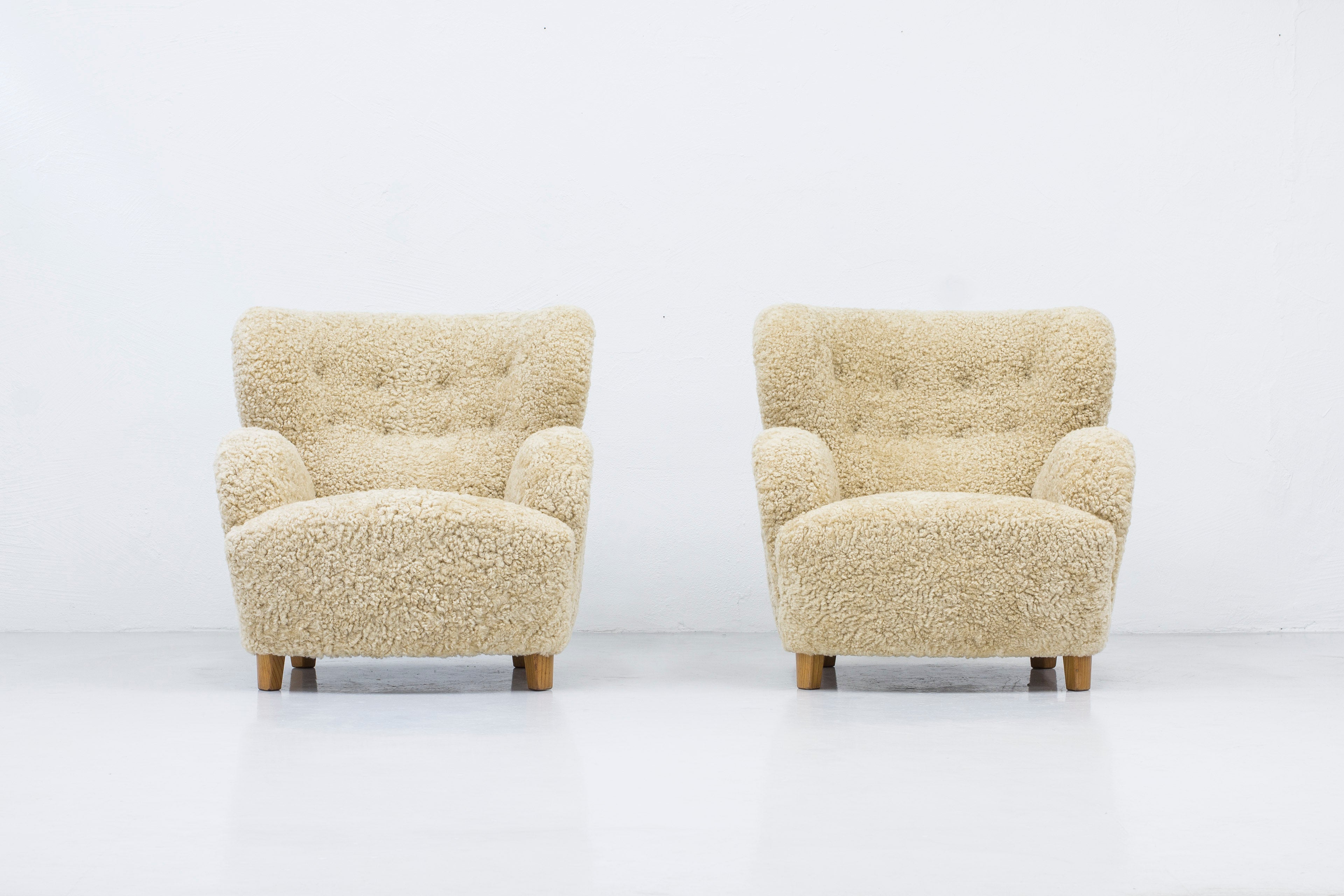 Sheep skin lounge chairs in the style of Lassen