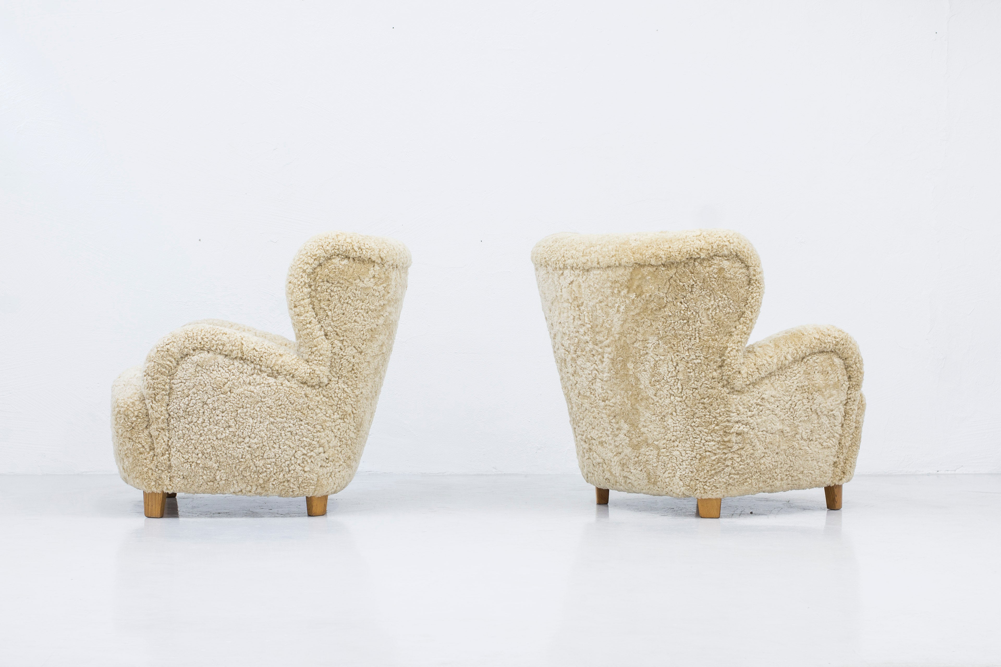 Sheep skin lounge chairs in the style of Lassen