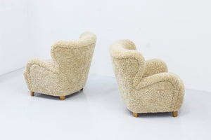 Sheep skin lounge chairs in the style of Lassen