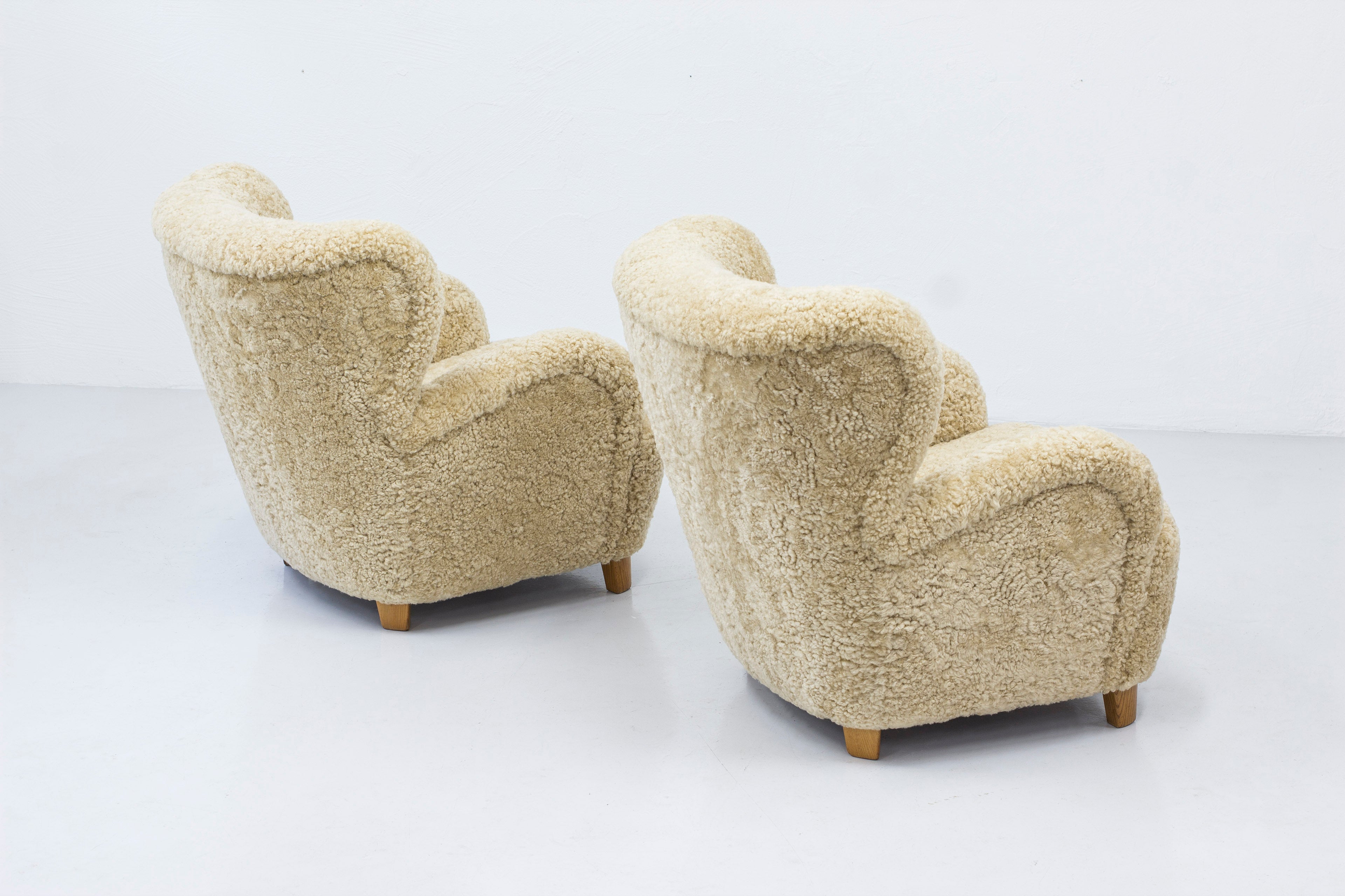 Sheep skin lounge chairs in the style of Lassen