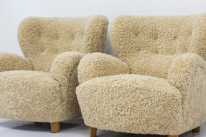 Sheep skin lounge chairs in the style of Lassen