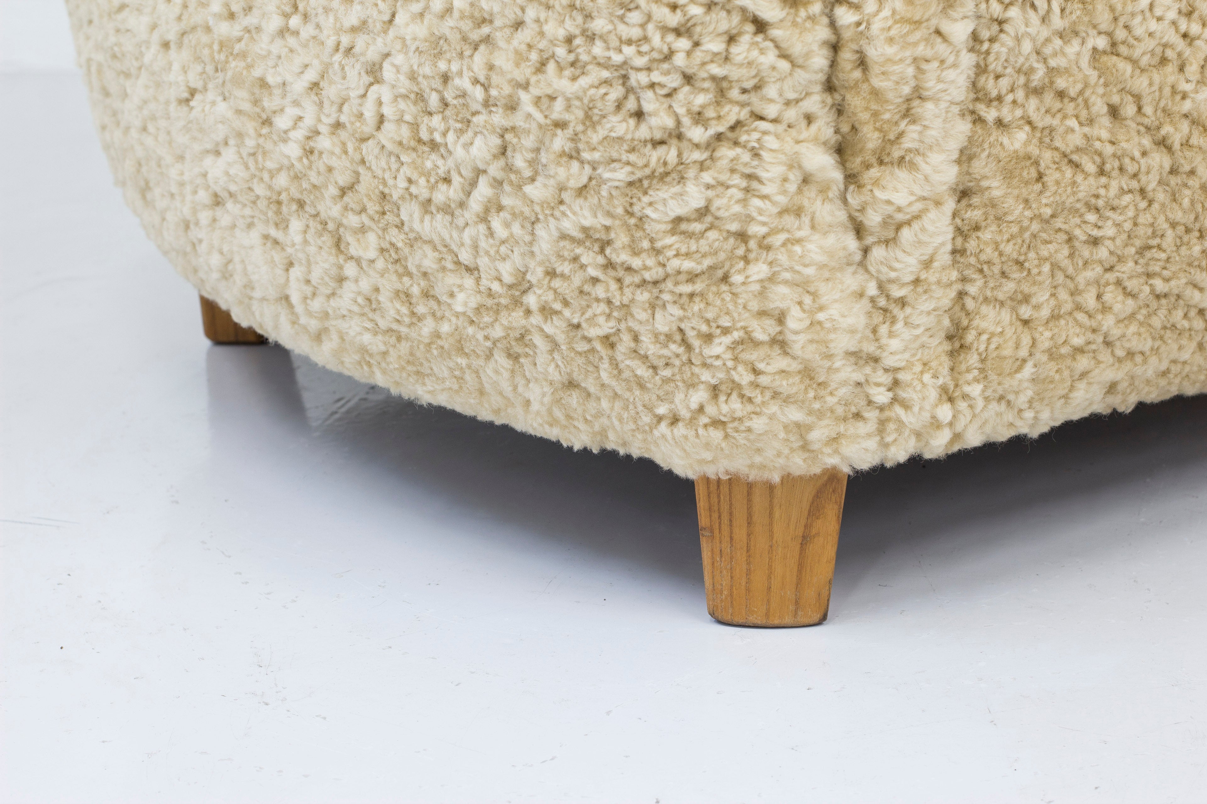 Sheep skin lounge chairs in the style of Lassen
