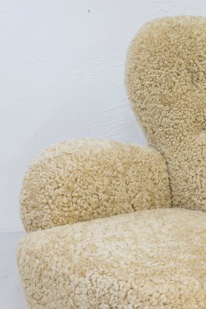 Sheep skin lounge chairs in the style of Lassen