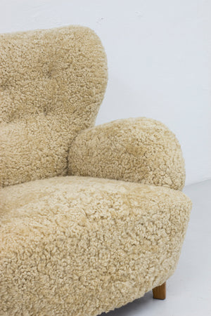 Sheep skin lounge chairs in the style of Lassen