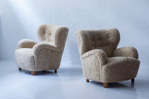 Sheep skin lounge chairs in the style of Lassen