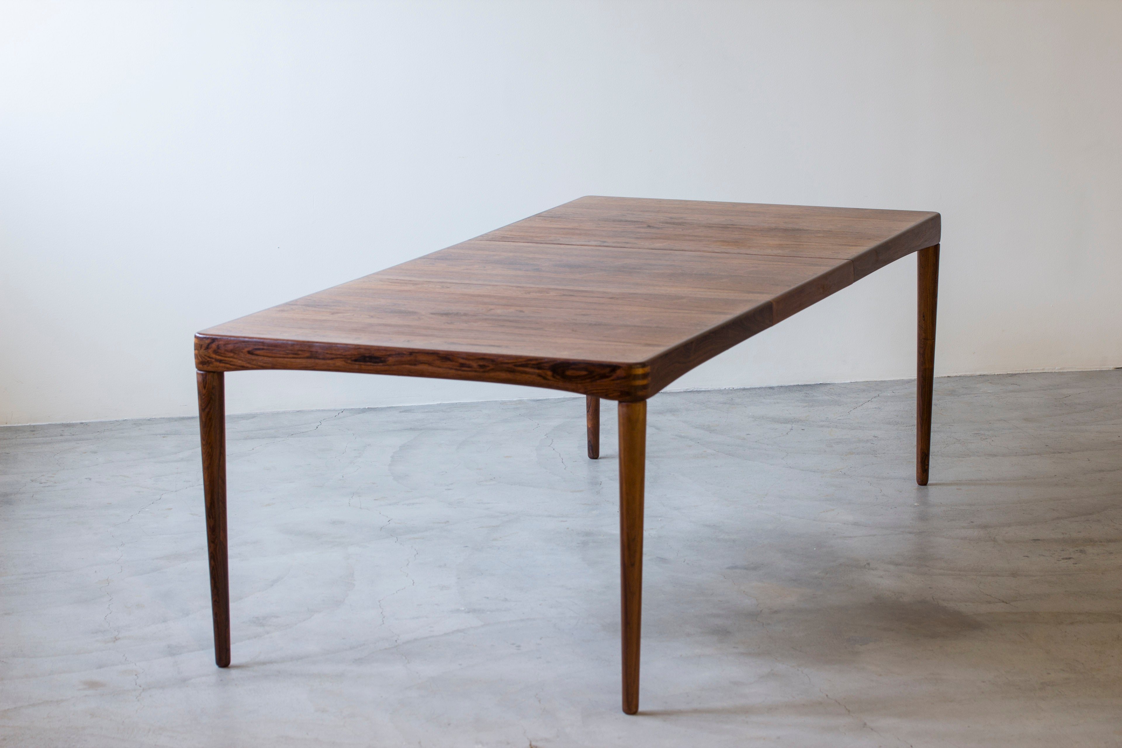 Palisander dining table by H. W Klein.