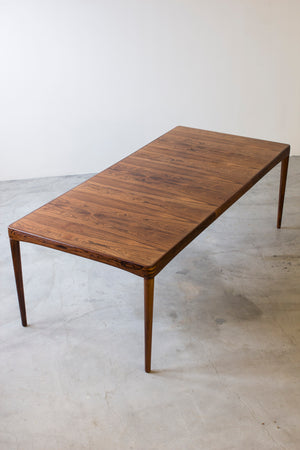 Palisander dining table by H. W Klein.