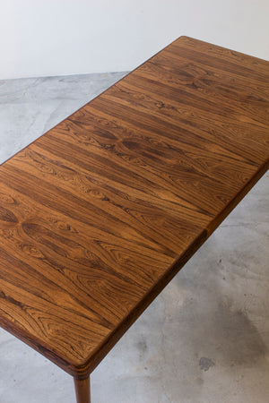Palisander dining table by H. W Klein.