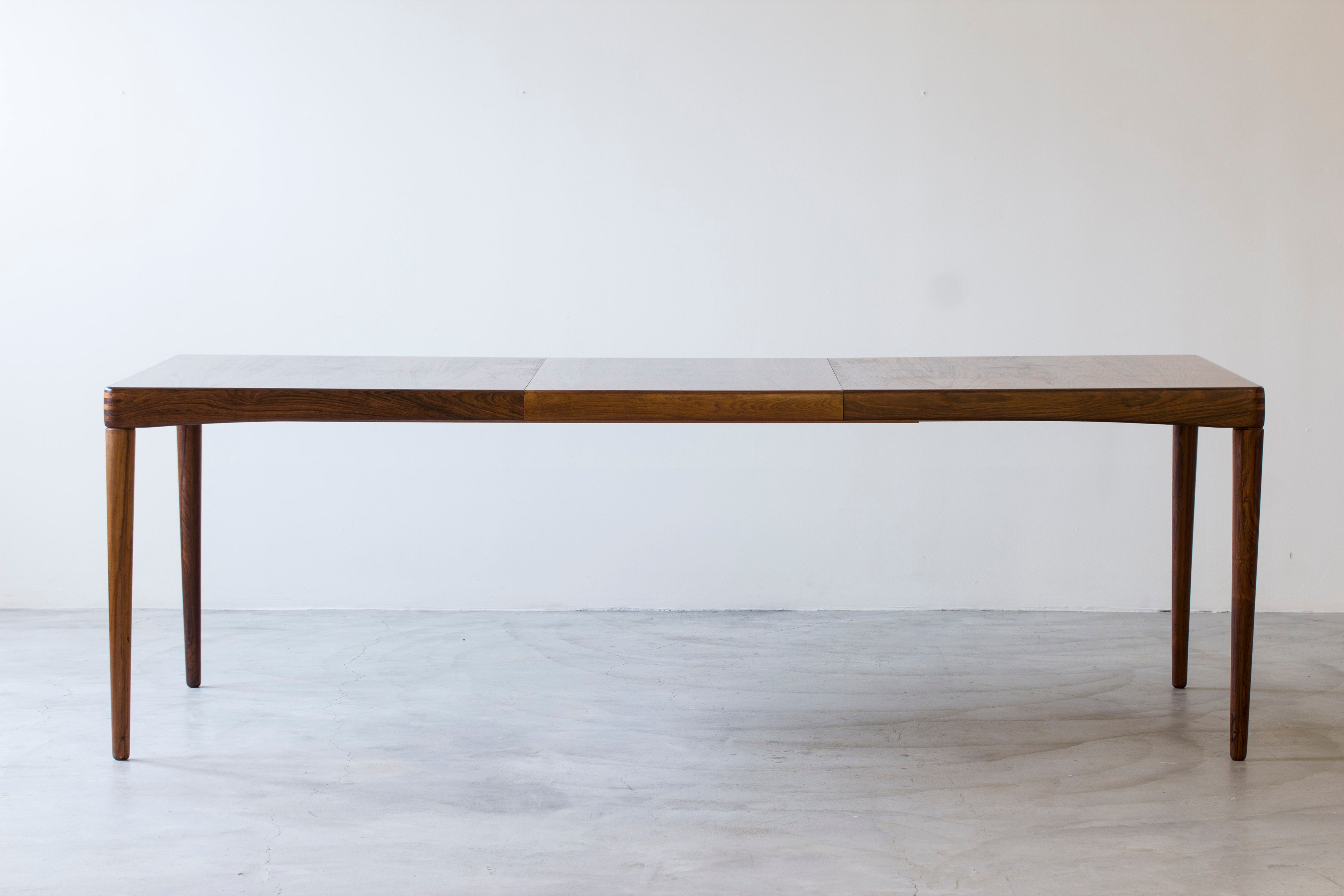 Palisander dining table by H. W Klein.