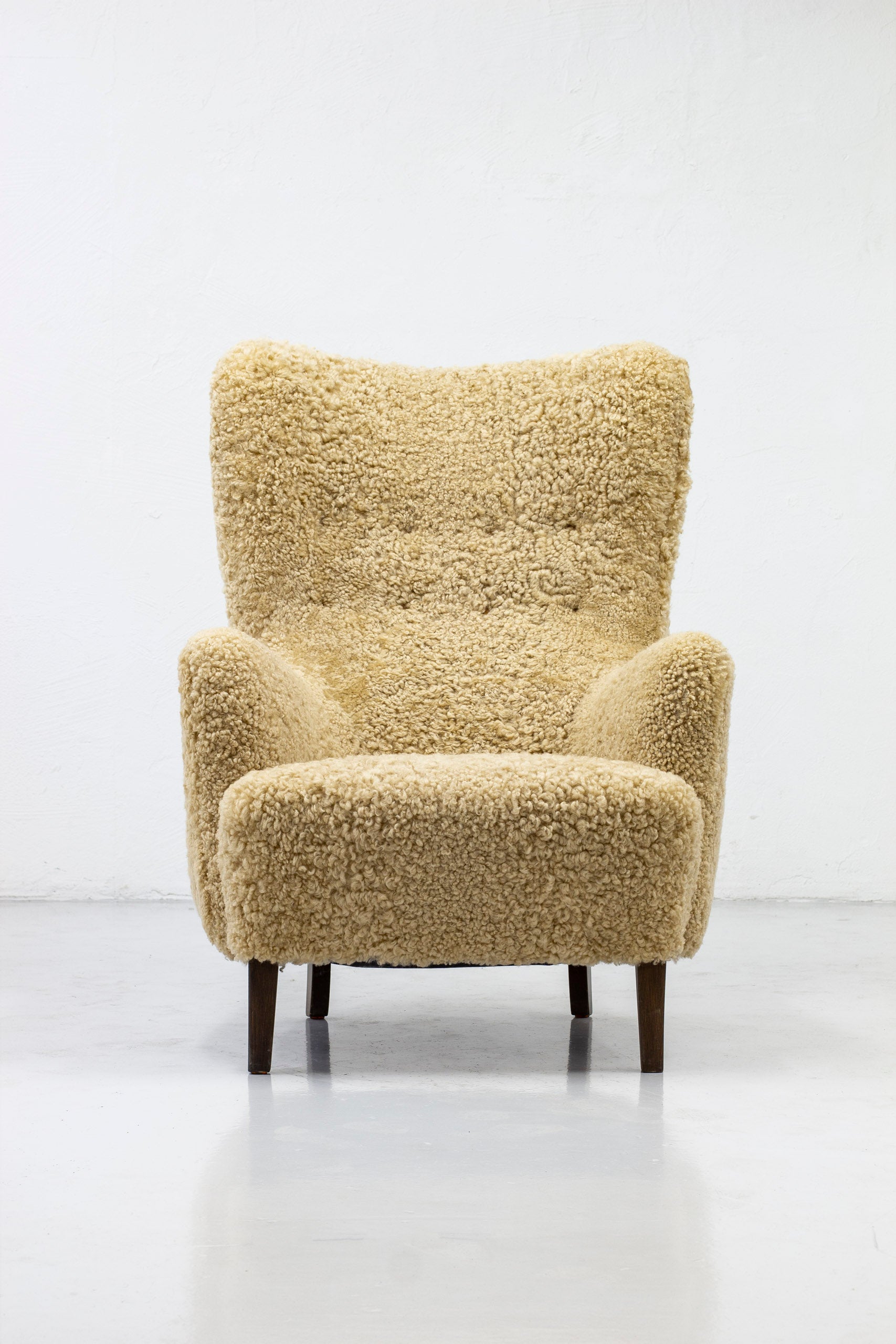 Danish modern high back chair with sheepskin