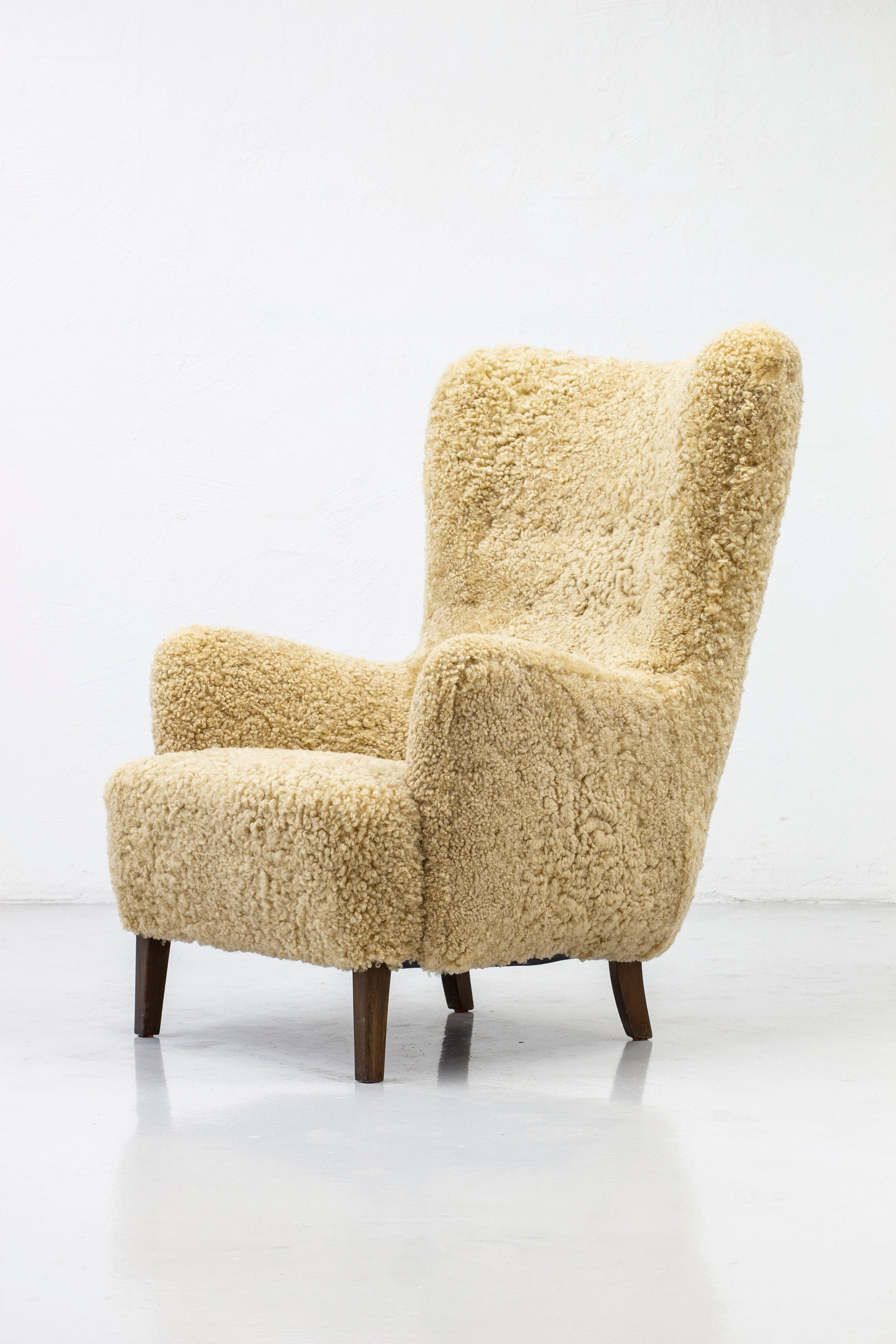Danish modern high back chair with sheepskin