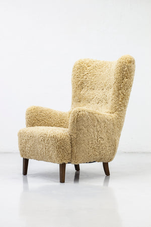 Danish modern high back chair with sheepskin