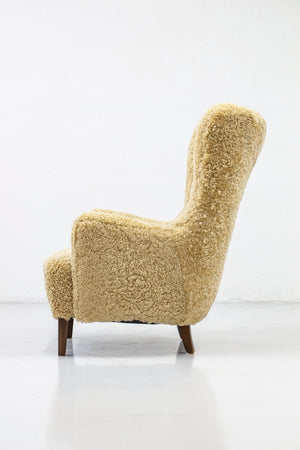 Danish modern high back chair with sheepskin