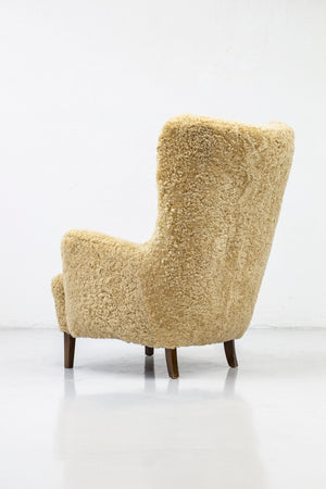 Danish modern high back chair with sheepskin