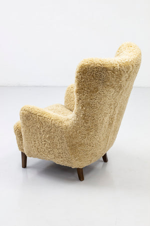 Danish modern high back chair with sheepskin