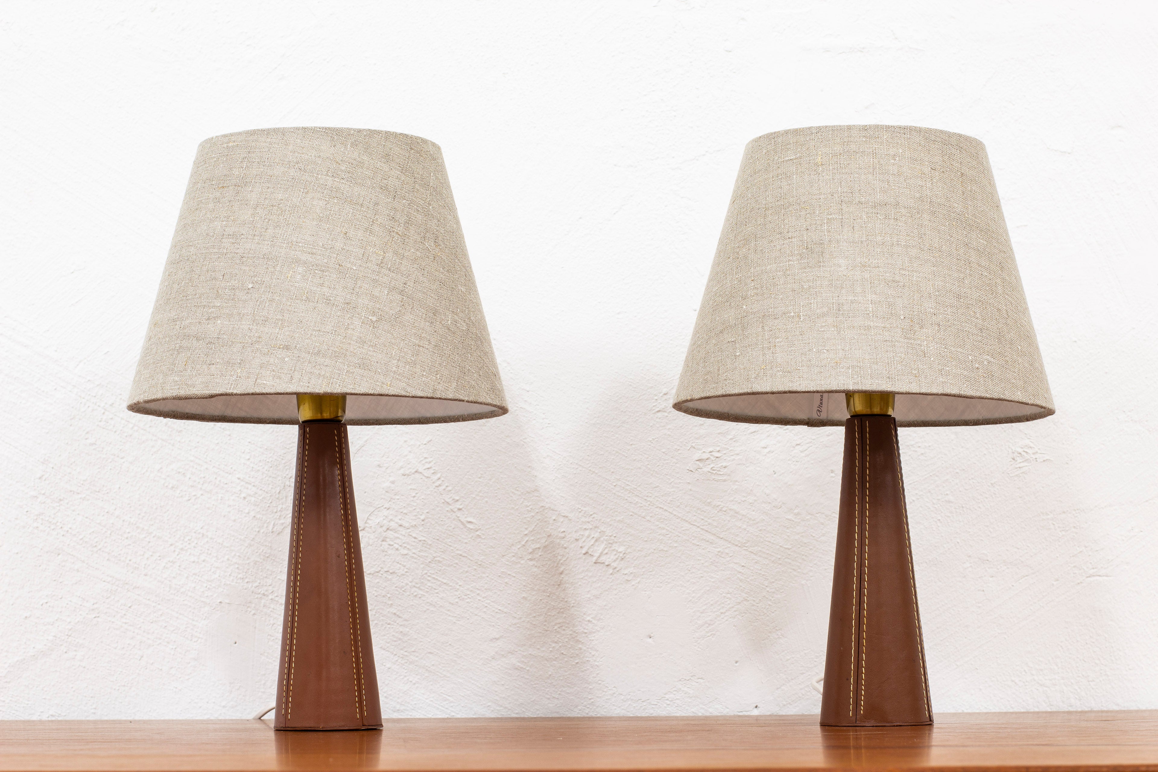 Leather table lamps in the manner of Pape
